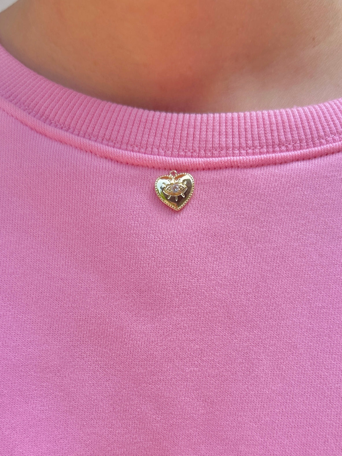 pink "good things are coming" crewneck with charm